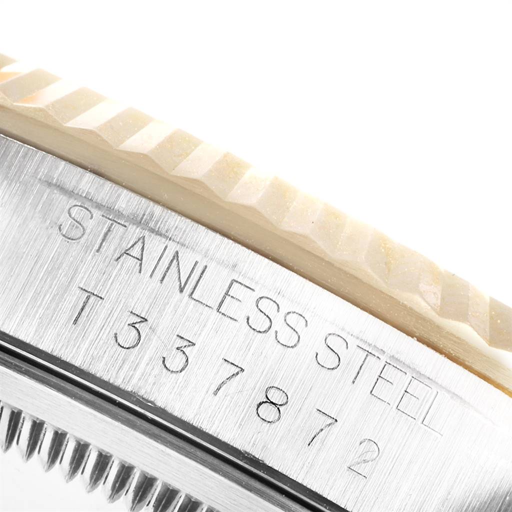 The image shows a close-up of the stainless steel case and fluted bezel of a Rolex Datejust 16233 Men's Steel and Gold (two tone) Grey Dial 16233 Men's Steel and Gold (two tone) Grey Dial watch.