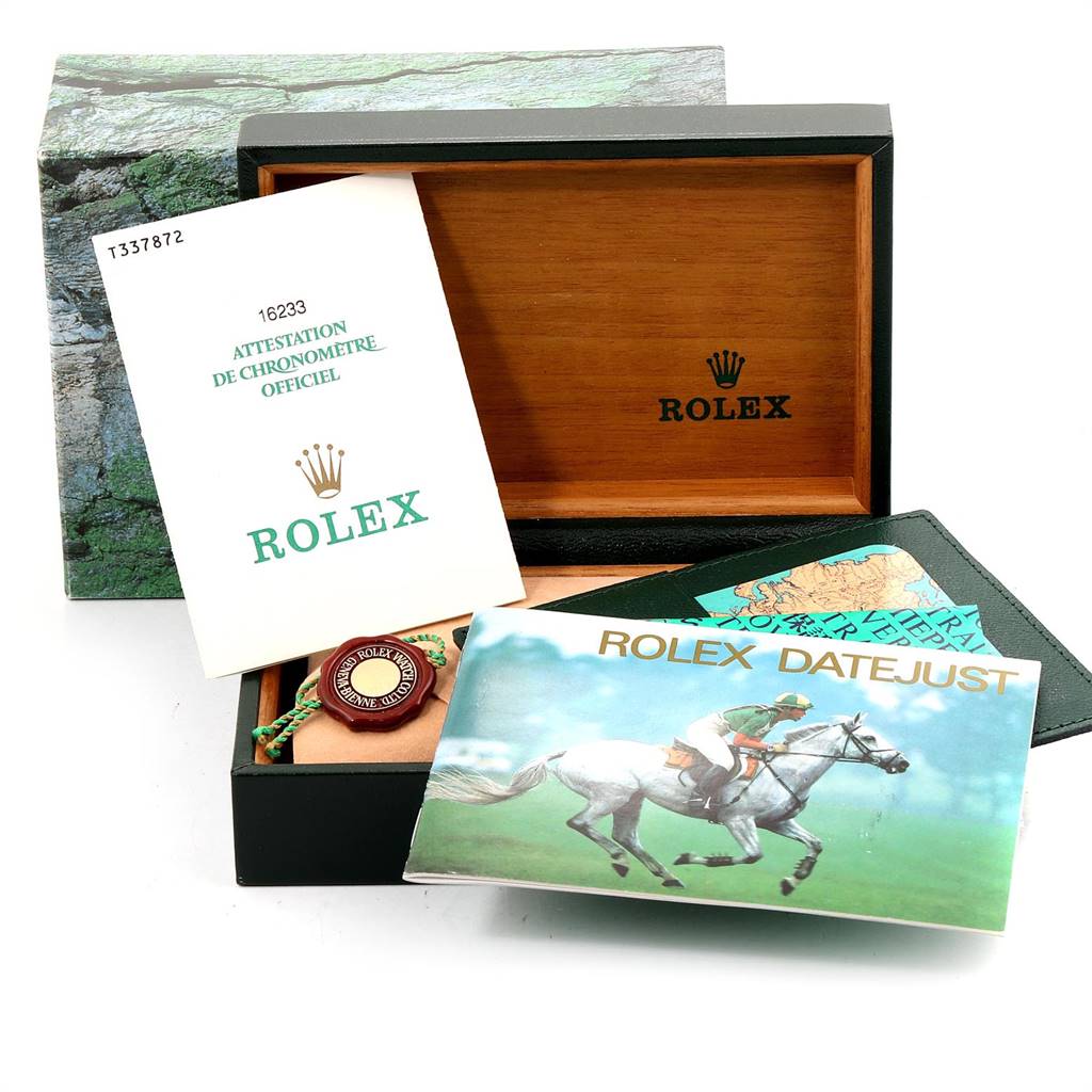 The image shows an open Rolex Datejust 16233 Men's Steel and Gold (two tone) Grey Dial 16233 Men's Steel and Gold (two tone) Grey Dial watch box with accompanying booklets and tags arranged inside and outside the box.