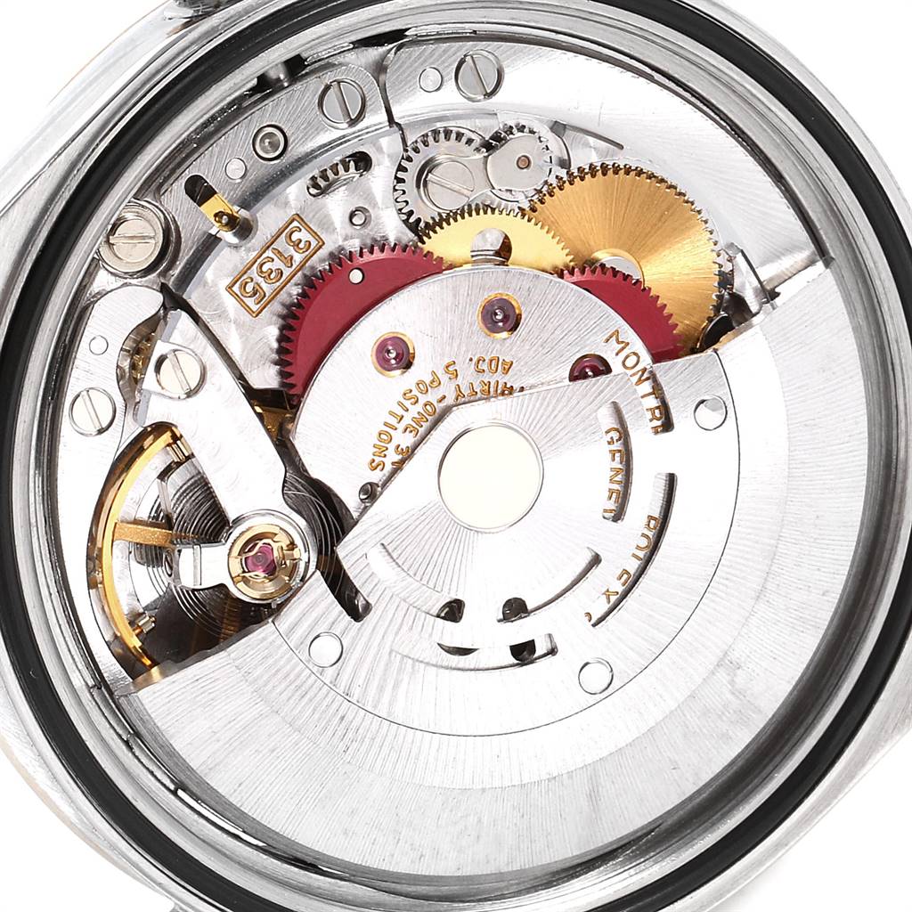 The image shows a close-up of the movement mechanism of a Rolex Datejust 16233 Men's Steel and Gold (two tone) Silver Dial 16233 Men's Steel and Gold (two tone) Silver Dial watch.
