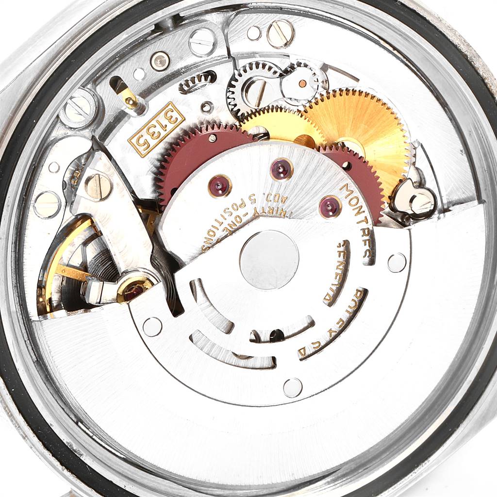 This image shows the internal mechanism of a Rolex Datejust 16233 Men
s Steel and Gold (two tone) Blue Dial 16233 Men
s Steel and Gold (two tone) Blue Dial watch, highlighting gears and components from the back view.