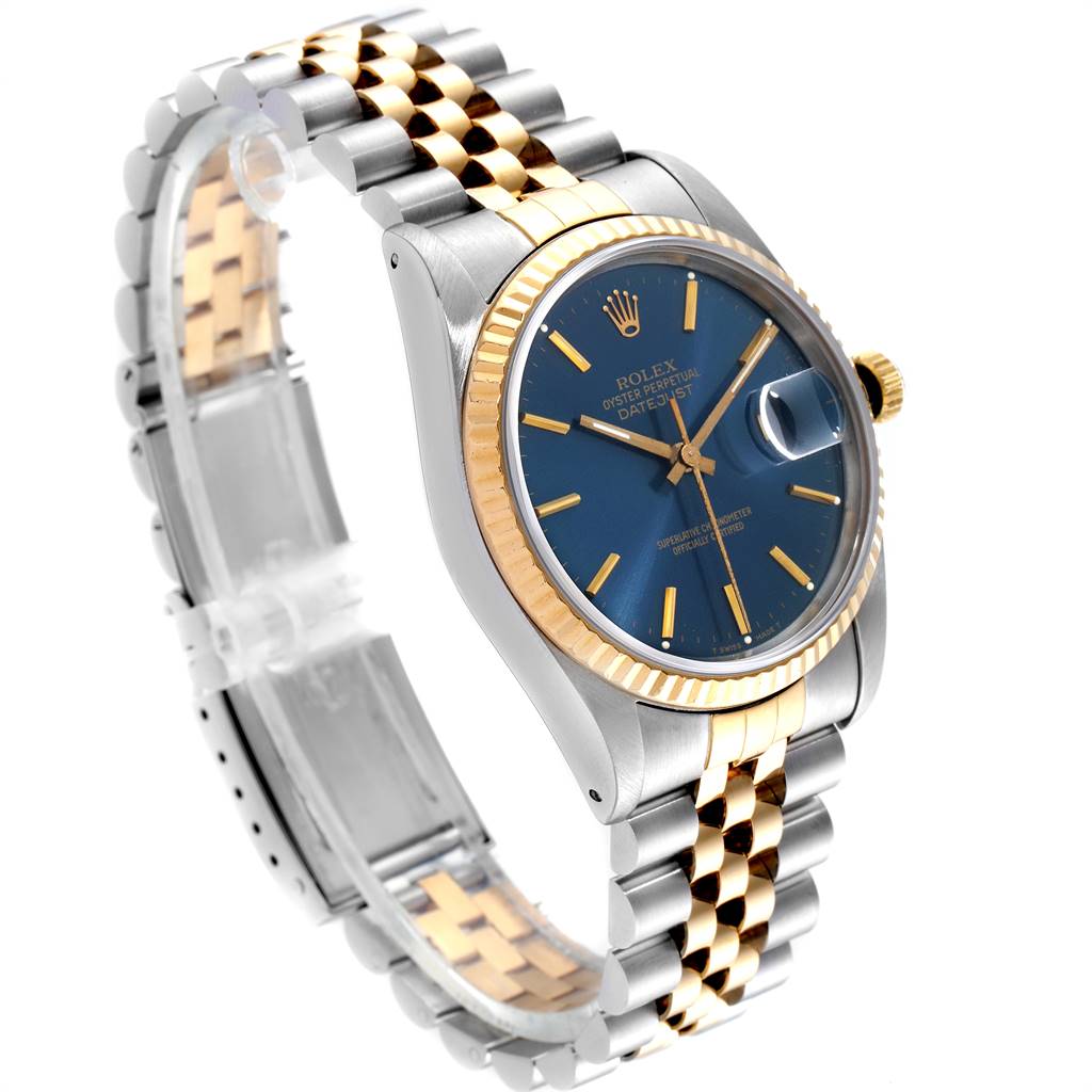 The image shows a Rolex Datejust 16233 Men
s Steel and Gold (two tone) Blue Dial 16233 Men
s Steel and Gold (two tone) Blue Dial watch from a side angle, highlighting its bracelet, bezel, and blue dial.