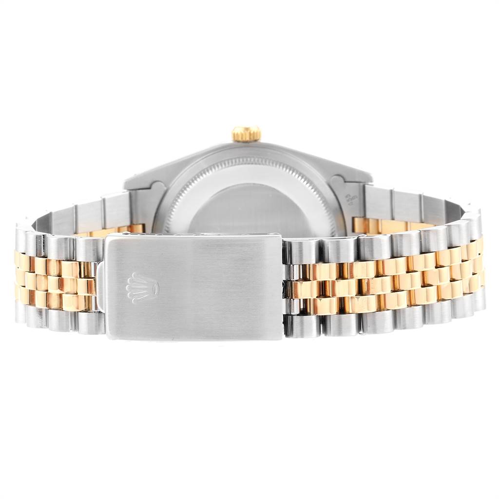 This image shows the back of a Rolex Datejust 16233 Men
s Steel and Gold (two tone) Blue Dial 16233 Men
s Steel and Gold (two tone) Blue Dial watch, featuring its case back and two-tone bracelet with the clasp visible.