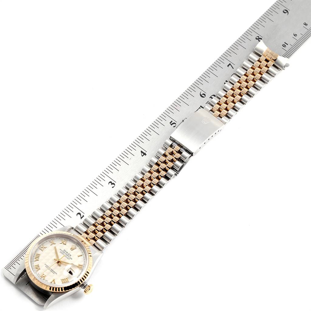 The image shows a Rolex Datejust 16233 Men's Steel and Gold (two tone) Beige Dial 16233 Men's Steel and Gold (two tone) Beige Dial watch and its bracelet laid out flat next to a ruler for measurement.