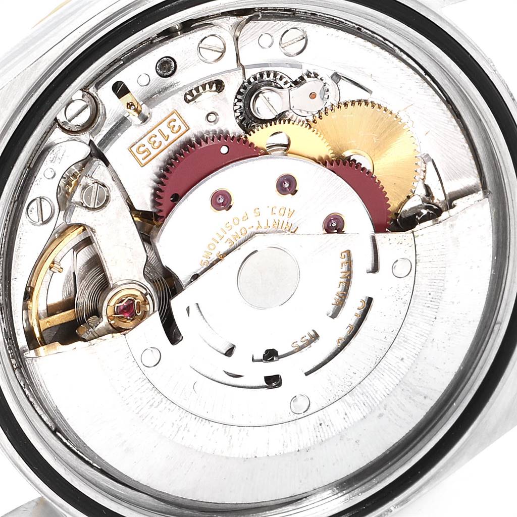This image shows the inner mechanisms, gears, and rotor of a Rolex Datejust 16233 Men's Steel and Gold (two tone) Champagne Dial 16233 Men's Steel and Gold (two tone) Champagne Dial watch from the back.