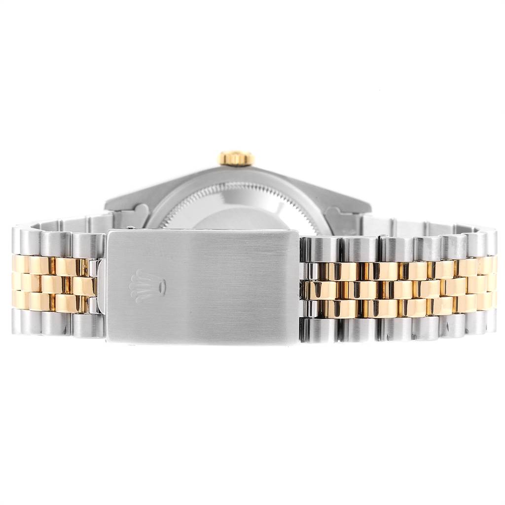 This image shows the back view of a Rolex Datejust 16233 Men's Steel and Gold (two tone) Champagne Dial 16233 Men's Steel and Gold (two tone) Champagne Dial watch, highlighting its two-tone bracelet and clasp.