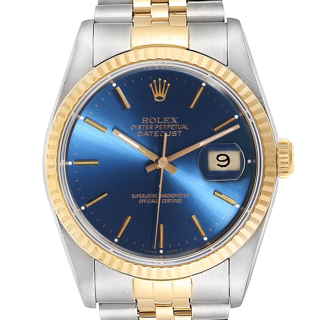 The Rolex Datejust 16233 Men's Steel and Gold (two tone) Blue Dial 16233 Men's Steel and Gold (two tone) Blue Dial watch is shown from a top-down angle, featuring its blue dial, gold fluted bezel, and two-tone bracelet.