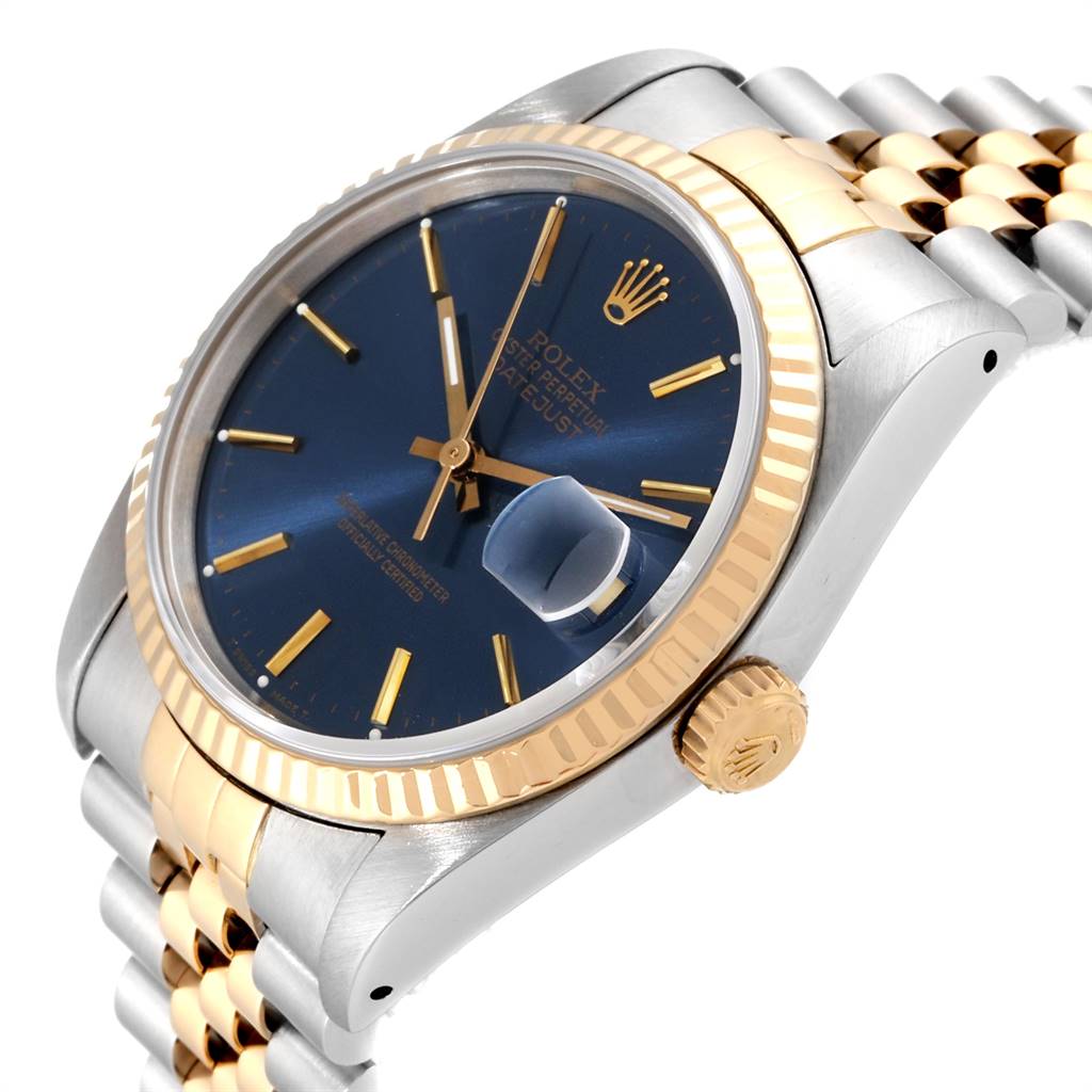The image shows a side angle of the Rolex Datejust 16233 Men's Steel and Gold (two tone) Blue Dial 16233 Men's Steel and Gold (two tone) Blue Dial watch, highlighting its blue dial, gold bezel, and two-tone Jubilee bracelet.
