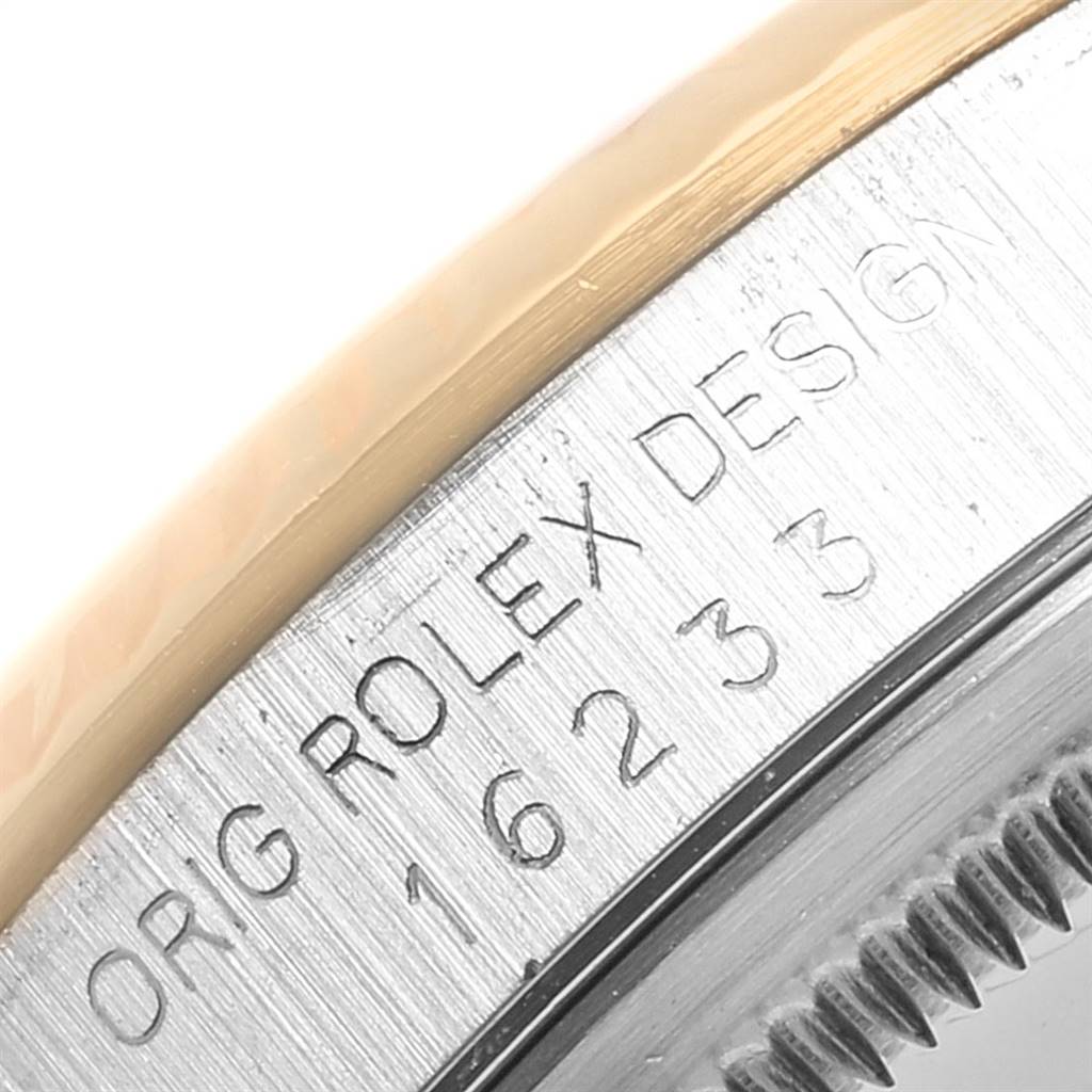 This image shows a close-up of the bezel and case side of a Rolex Datejust 16233 Men's Steel and Gold (two tone) Blue Dial 16233 Men's Steel and Gold (two tone) Blue Dial watch, revealing the model number and "ROLEX DESIGN" engraving.