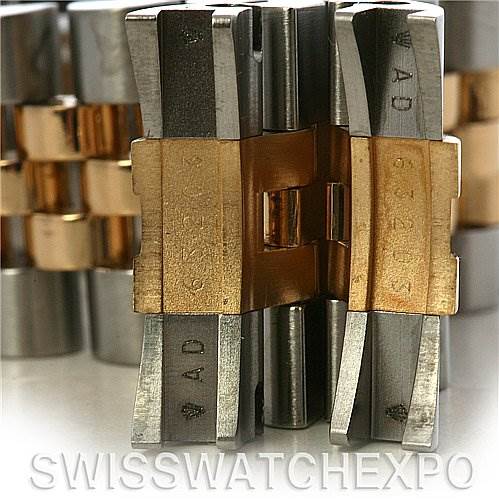 This image shows a close-up angle of a Rolex Datejust 116233 Men's Stainless Steel White Dial 116233 Men's Stainless Steel White Dial bracelet clasp mechanism in stainless steel and gold.