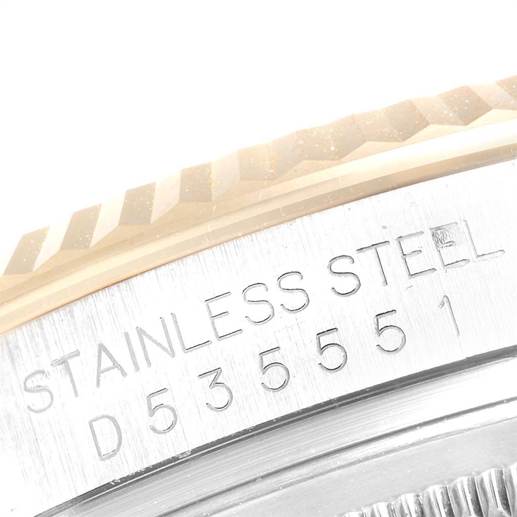 The image shows a close-up of the serial number and "Stainless Steel" engraving on the case of a Rolex Datejust 116233 Men's Stainless Steel White Dial 116233 Men's Stainless Steel White Dial watch.