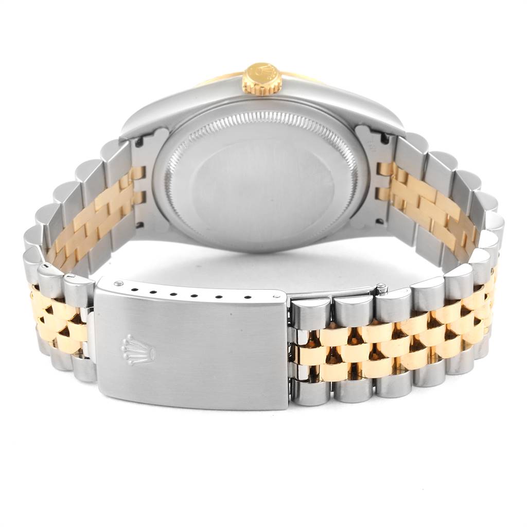 This image shows the back case, crown, and bracelet of the Rolex Datejust 16233 Men's Steel and Gold (two tone) Grey Dial 16233 Men's Steel and Gold (two tone) Grey Dial watch with a two-tone metal design.