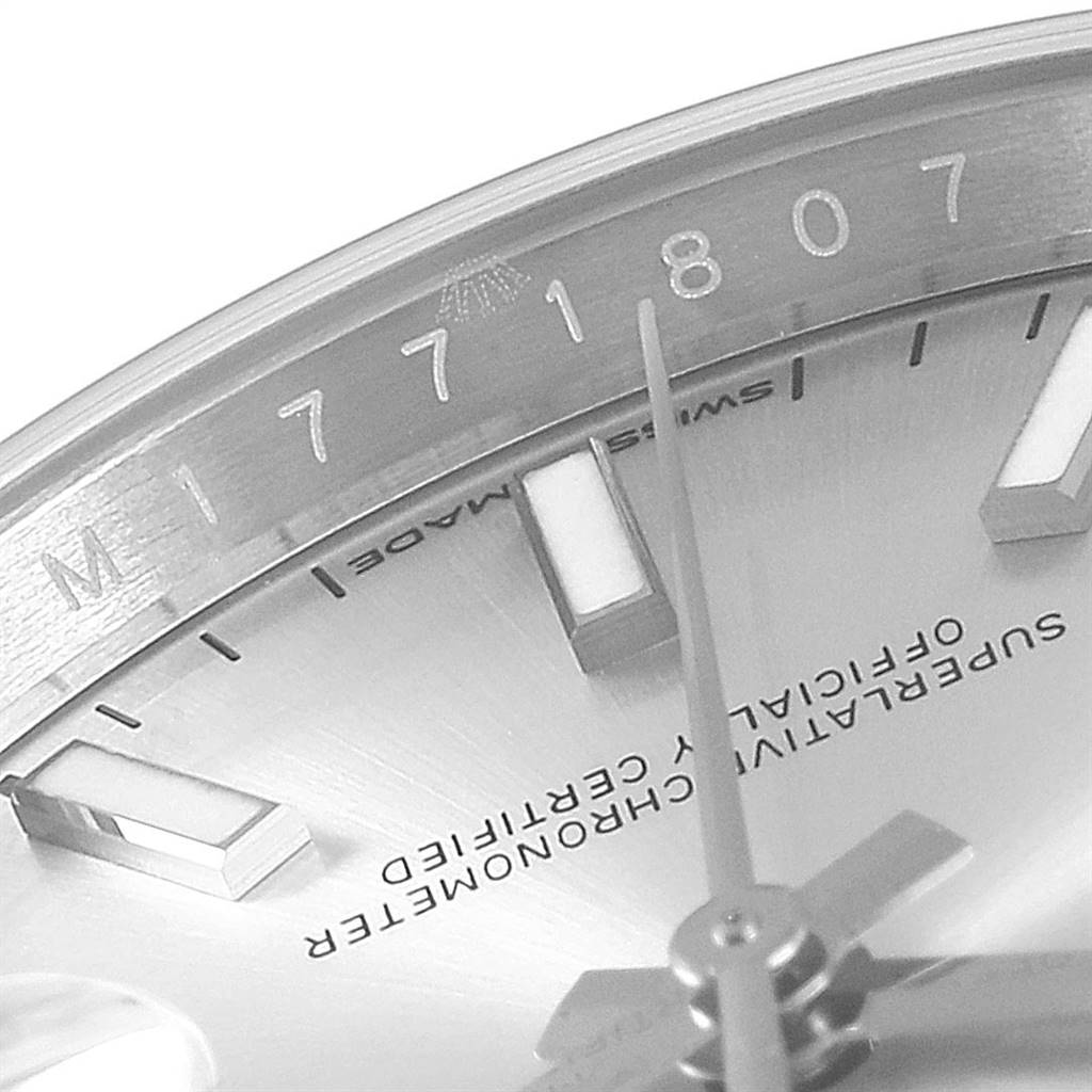 This close-up image shows the serial number, partial dial, and minute hand of a Rolex Datejust 126234 Men's Stainless Steel Silver Dial 126234 Men's Stainless Steel Silver Dial model.