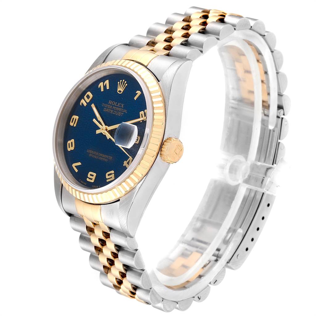 The image shows a side angle of a Rolex Datejust 16233 Men
s Steel and Gold (two tone) Blue Dial 16233 Men
s Steel and Gold (two tone) Blue Dial watch, highlighting its blue dial, gold fluted bezel, and two-tone bracelet.