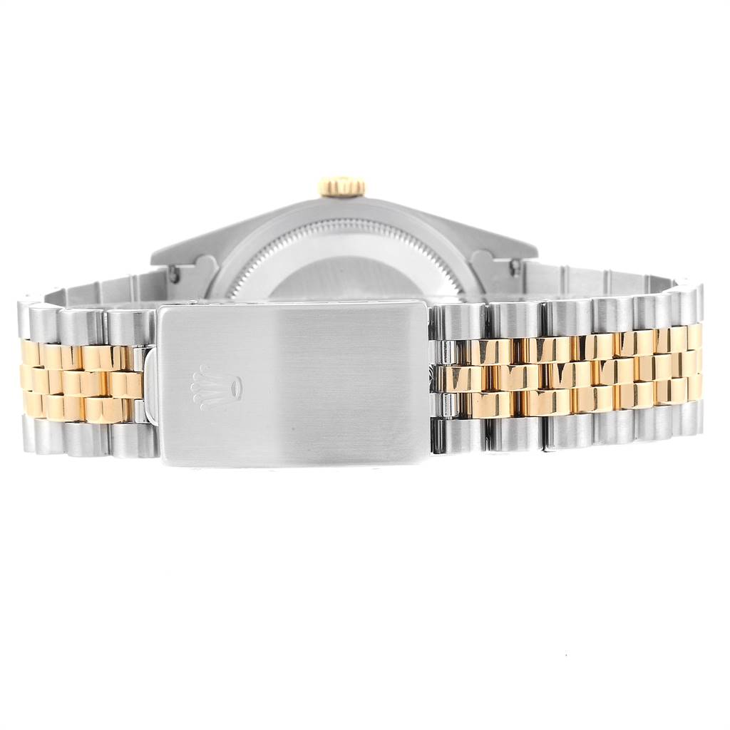 The image shows the back view of a Rolex Datejust 16233 Men
s Steel and Gold (two tone) Blue Dial 16233 Men
s Steel and Gold (two tone) Blue Dial watch, highlighting its two-tone bracelet and clasp.