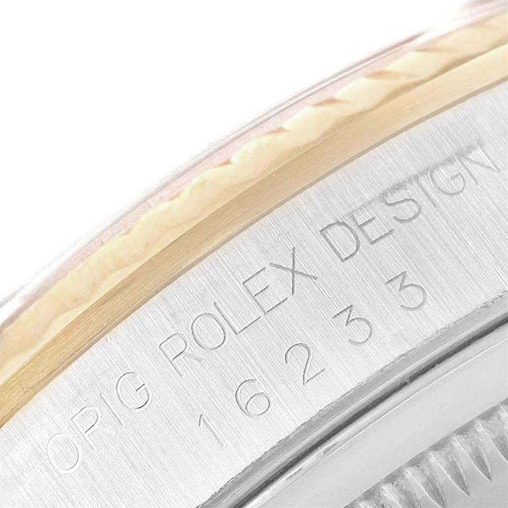 This image shows a close-up of the engraved case back and bezel of a Rolex Datejust 16233 Men
s Steel and Gold (two tone) Blue Dial 16233 Men
s Steel and Gold (two tone) Blue Dial watch, highlighting the model number 16233.