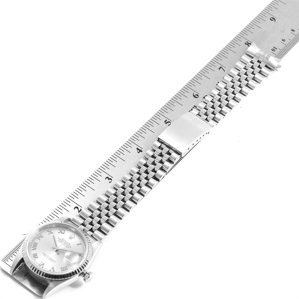 The image shows a Rolex Datejust 16234 Men's Stainless Steel Silver Dial 16234 Men's Stainless Steel Silver Dial watch from a top-down angle, including the face, bracelet, and clasp, placed alongside a ruler.