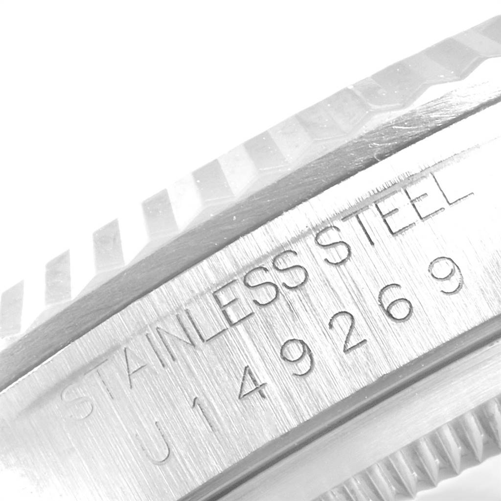 Close-up of the side casing and bezel of a Rolex Datejust 16234 Men's Stainless Steel Silver Dial 16234 Men's Stainless Steel Silver Dial, showing the "STAINLESS STEEL" engraving and serial number.
