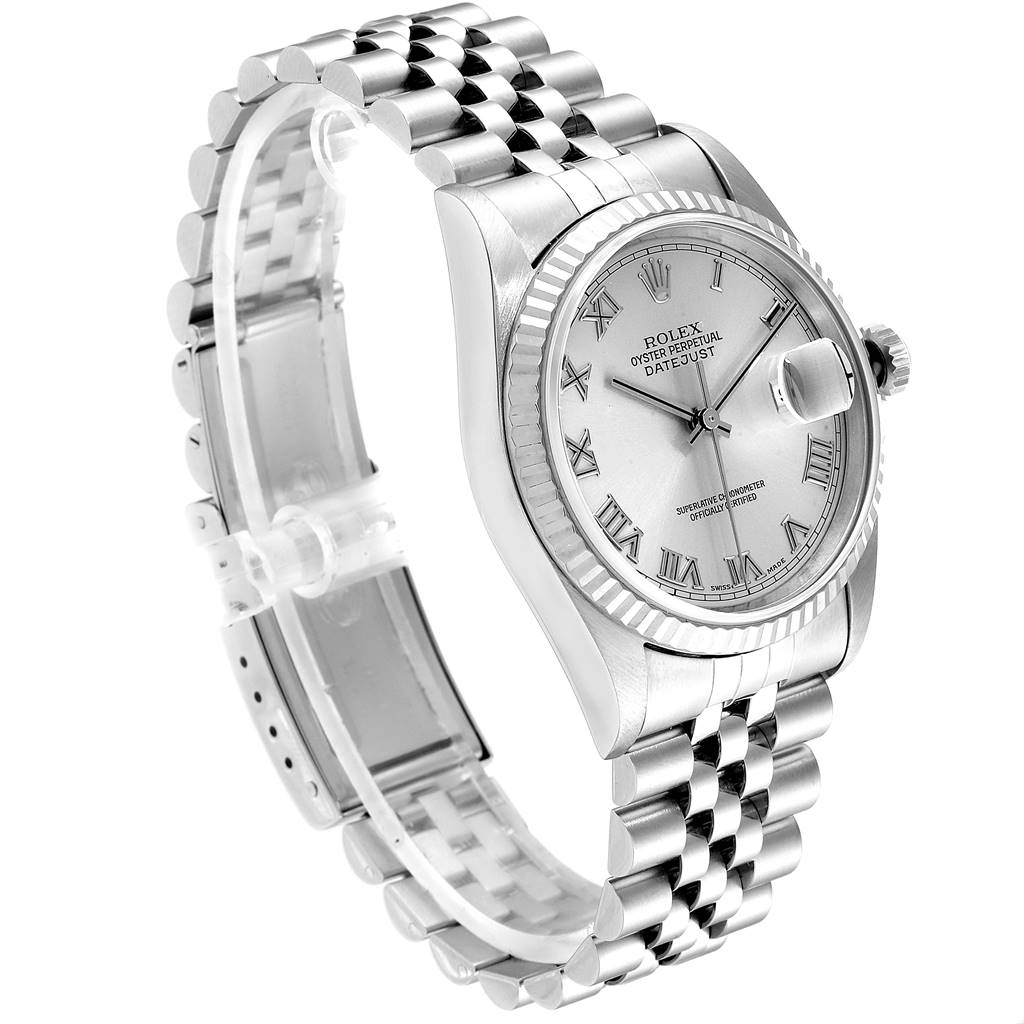 The Rolex Datejust 16234 Men's Stainless Steel Silver Dial 16234 Men's Stainless Steel Silver Dial watch is shown at an angle highlighting its face, fluted bezel, and Jubilee bracelet.