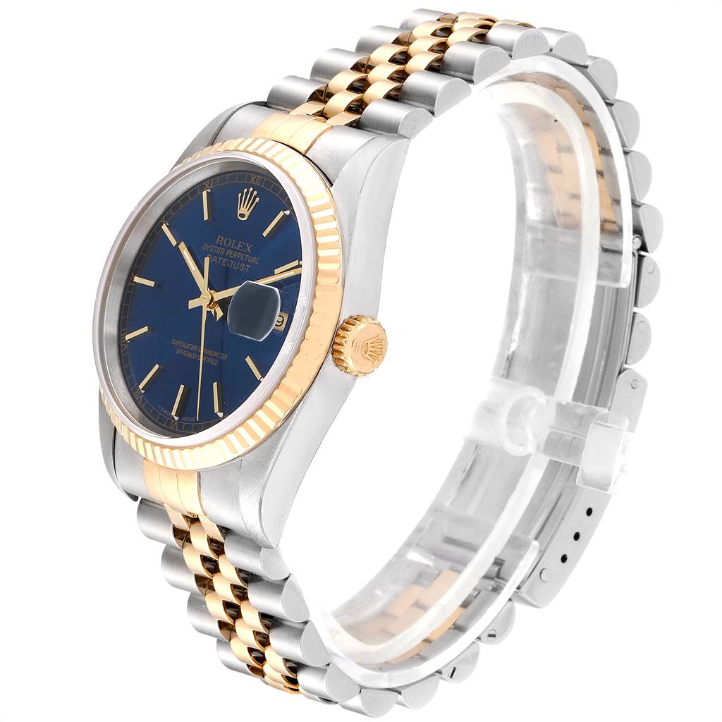 The image shows a side angle of a Rolex Datejust 16233 Men's Steel and Gold (two tone) Blue Dial 16233 Men's Steel and Gold (two tone) Blue Dial watch, featuring its bezel, dial, crown, and two-tone bracelet.