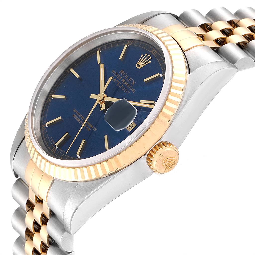 The image shows a side angle of the Rolex Datejust 16233 Men's Steel and Gold (two tone) Blue Dial 16233 Men's Steel and Gold (two tone) Blue Dial watch, highlighting the crown, bezel, dial, and parts of the bracelet.