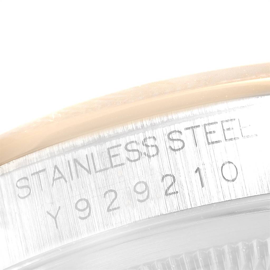 This close-up shows the engraving on the side of a stainless steel Rolex Datejust 16203 Men's Steel and Gold (two tone) Grey Dial 16203 Men's Steel and Gold (two tone) Grey Dial watch case.
