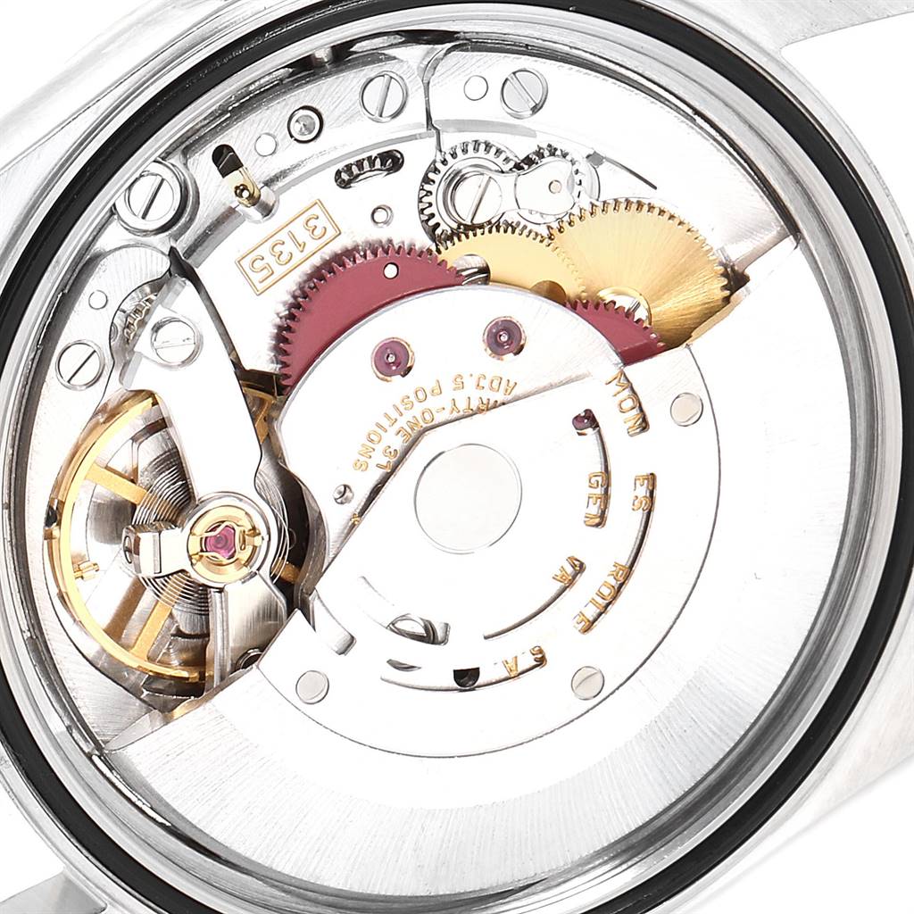 This is an interior view of the Rolex Datejust 16203 Men's Steel and Gold (two tone) Grey Dial 16203 Men's Steel and Gold (two tone) Grey Dial watch, showcasing its intricate mechanical movement components.
