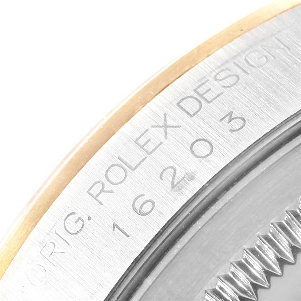 This image shows a close-up of the serial number engraving on the case back of a Rolex Datejust 16203 Men's Steel and Gold (two tone) Grey Dial 16203 Men's Steel and Gold (two tone) Grey Dial watch.