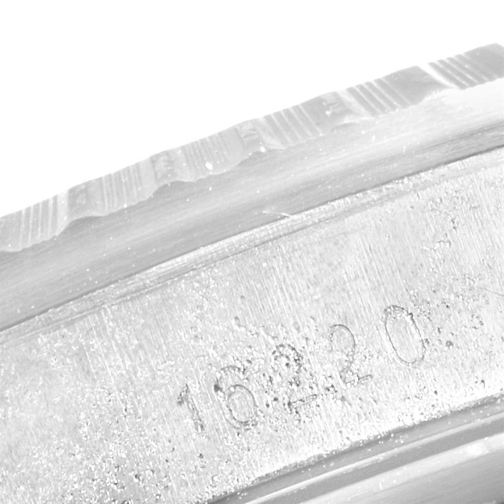 This close-up image shows the engraved model number on the inner bezel of a Rolex Datejust 16220 Men's Stainless Steel Silver Dial 16220 Men's Stainless Steel Silver Dial watch.
