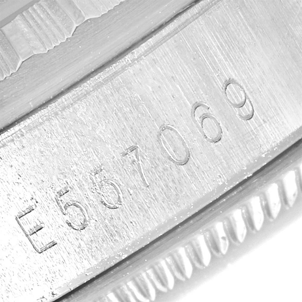 The image shows a close-up view of the serial number engraved on the case side of a Rolex Datejust 16220 Men's Stainless Steel Silver Dial 16220 Men's Stainless Steel Silver Dial watch.