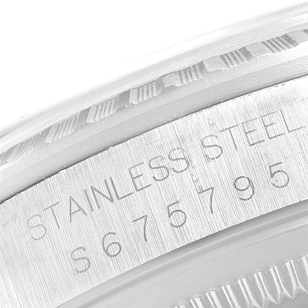 This close-up image shows the stainless steel casing and engraving details of a Rolex Datejust 16220 Men's Stainless Steel Silver Dial 16220 Men's Stainless Steel Silver Dial watch.