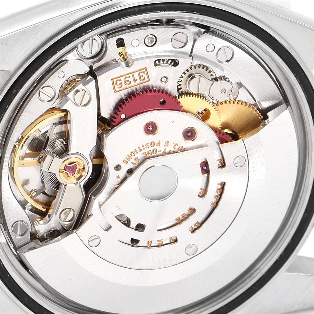 This is a detailed view of the internal mechanism of a Rolex Datejust 16220 Men's Stainless Steel Silver Dial 16220 Men's Stainless Steel Silver Dial watch, showcasing its gears and movement components.