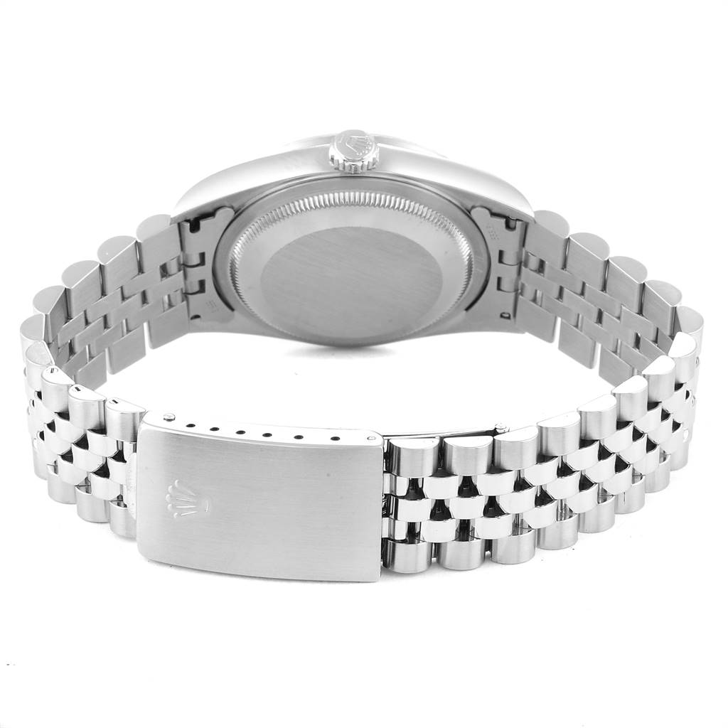 This is a rear view of the Rolex Datejust 16220 Men's Stainless Steel Silver Dial 16220 Men's Stainless Steel Silver Dial showing the case back, crown, and bracelet with the clasp.