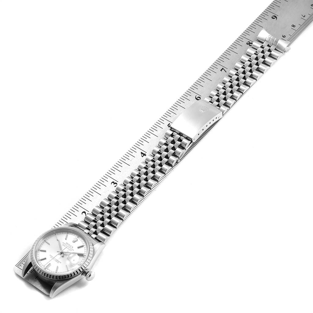 The image shows a Rolex Datejust 16220 Men's Stainless Steel Silver Dial 16220 Men's Stainless Steel Silver Dial watch laid flat alongside a ruler, displaying its case, dial, and entire bracelet.