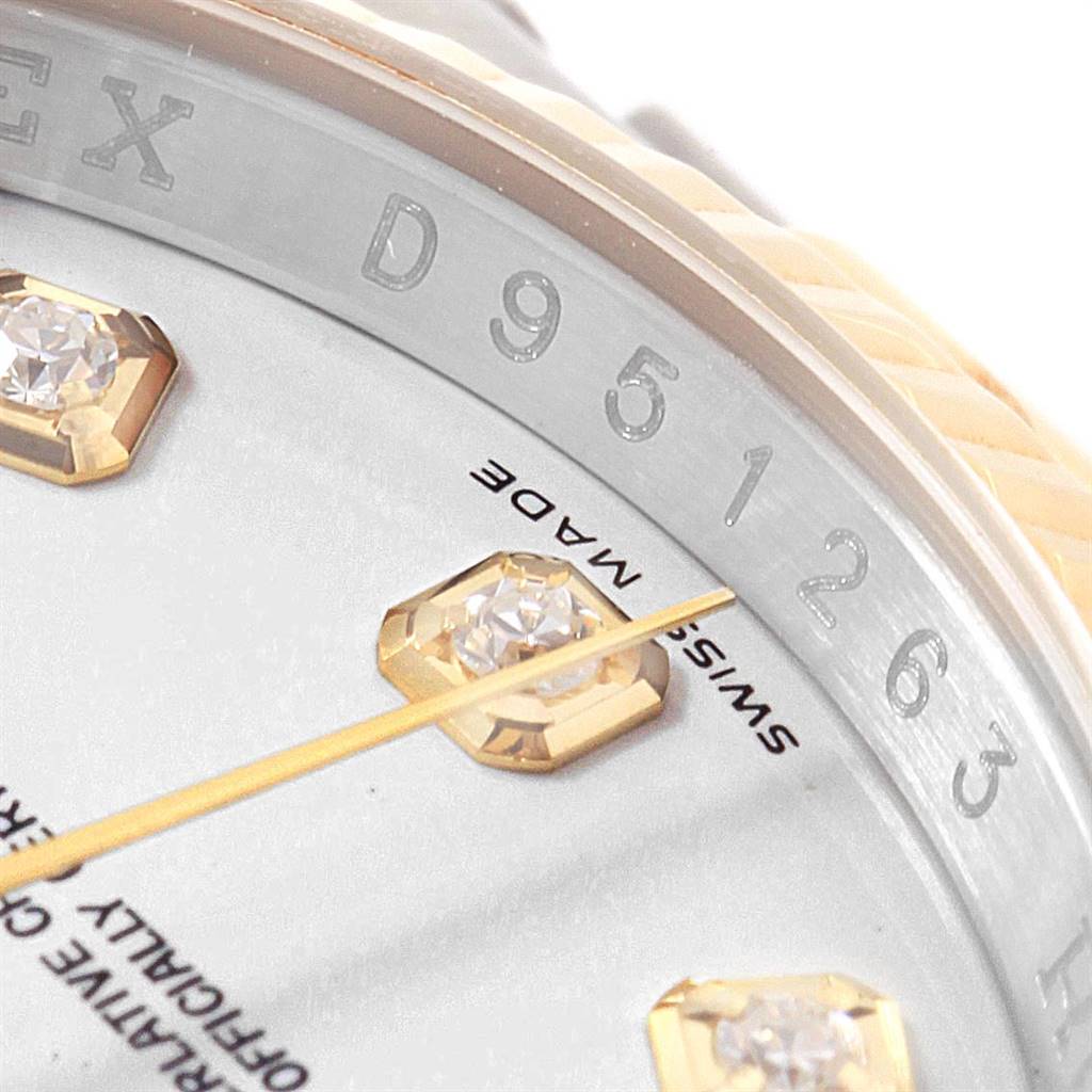 Close-up angle of the Rolex Datejust 116233 Men's Steel and Gold (two tone) Silver Dial 116233 Men's Steel and Gold (two tone) Silver Dial watch showing part of the dial, markers, and "Swiss Made" text.