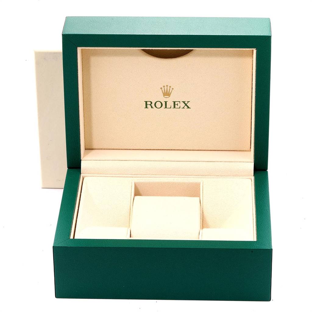 The image shows an open Rolex Datejust 116243 Men's Steel and Gold (two tone) White Dial 116243 Men's Steel and Gold (two tone) White Dial watch box, featuring its green exterior and cream interior with compartments.