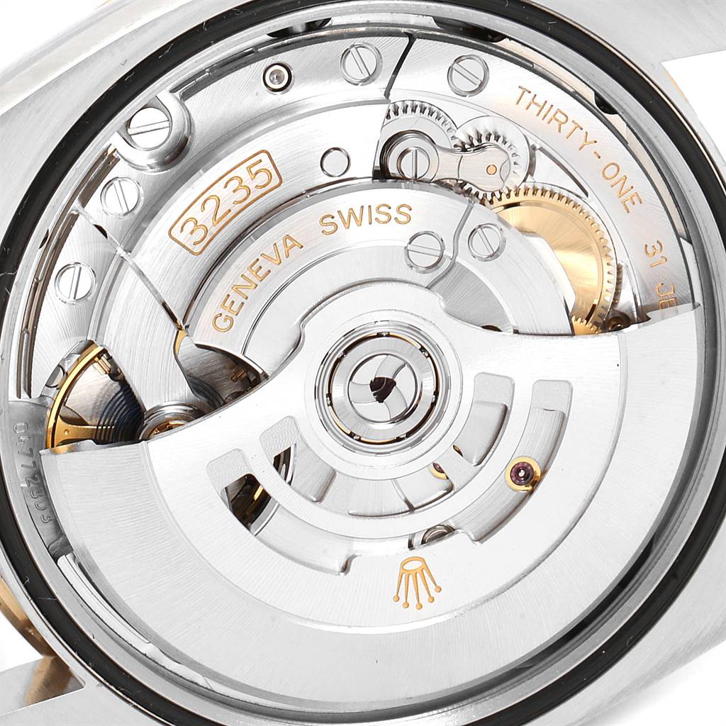 This image shows the movement and inner workings of a Rolex Datejust 126233 Men
s Steel and Gold (two tone) White Dial 126233 Men
s Steel and Gold (two tone) White Dial watch from a back angle.
