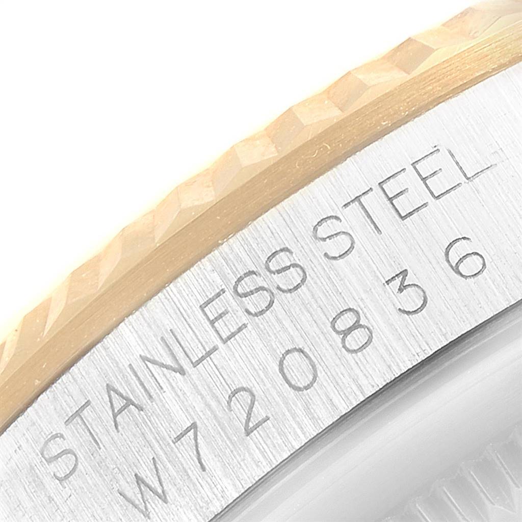 This image shows a close-up of the bezel and engraved serial number on a Rolex Datejust 16233 Men's Steel and Gold (two tone) Blue Dial 16233 Men's Steel and Gold (two tone) Blue Dial watch.