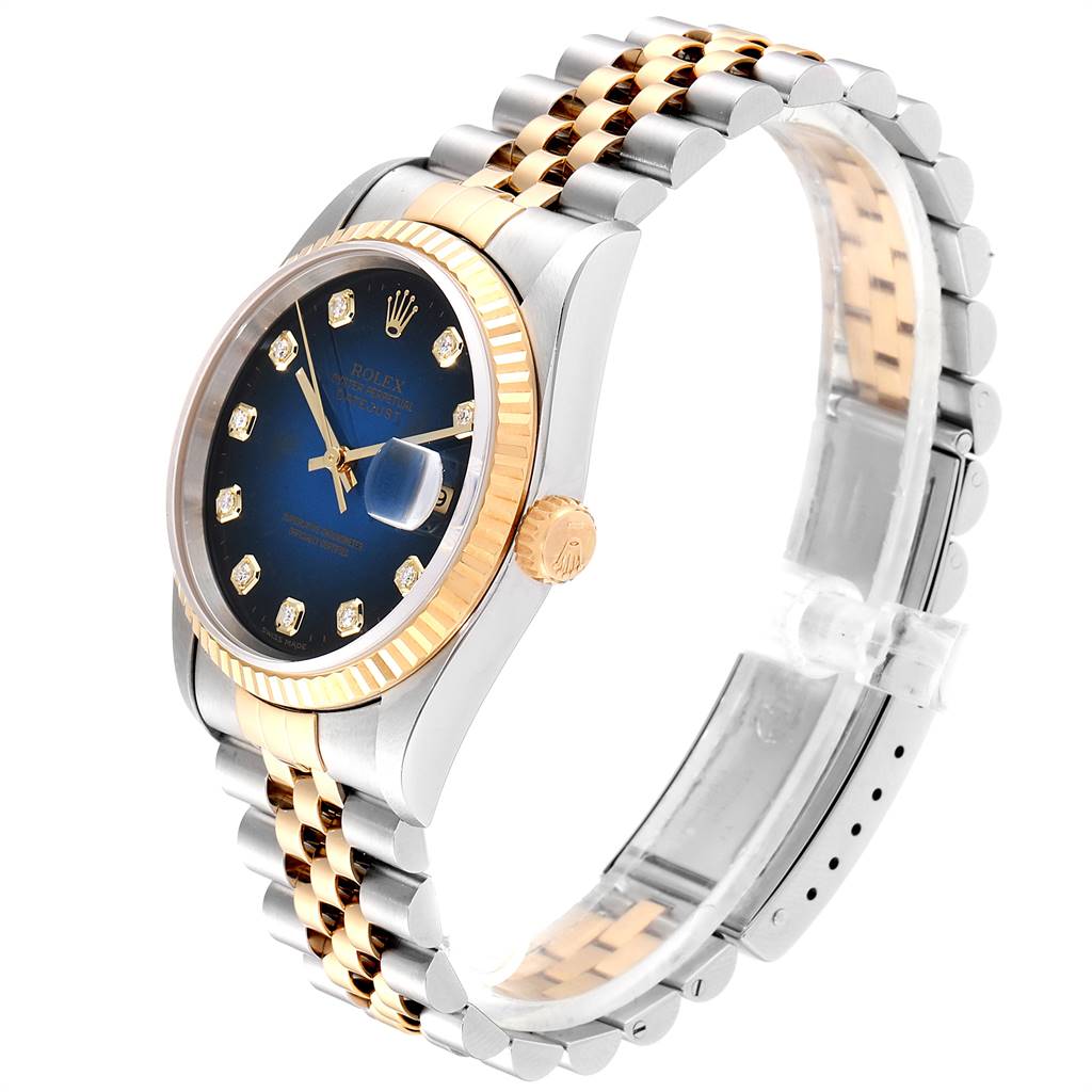 The image shows a side angle of a Rolex Datejust 16233 Men's Steel and Gold (two tone) Blue Dial 16233 Men's Steel and Gold (two tone) Blue Dial watch, highlighting the blue dial, two-tone bracelet, and fluted bezel.