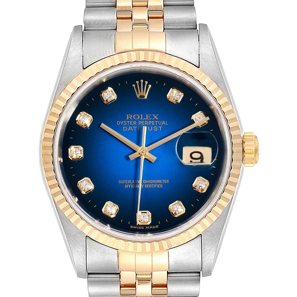 The image shows a Rolex Datejust 16233 Men's Steel and Gold (two tone) Blue Dial 16233 Men's Steel and Gold (two tone) Blue Dial watch front view, emphasizing its blue dial, fluted bezel, and two-tone bracelet.