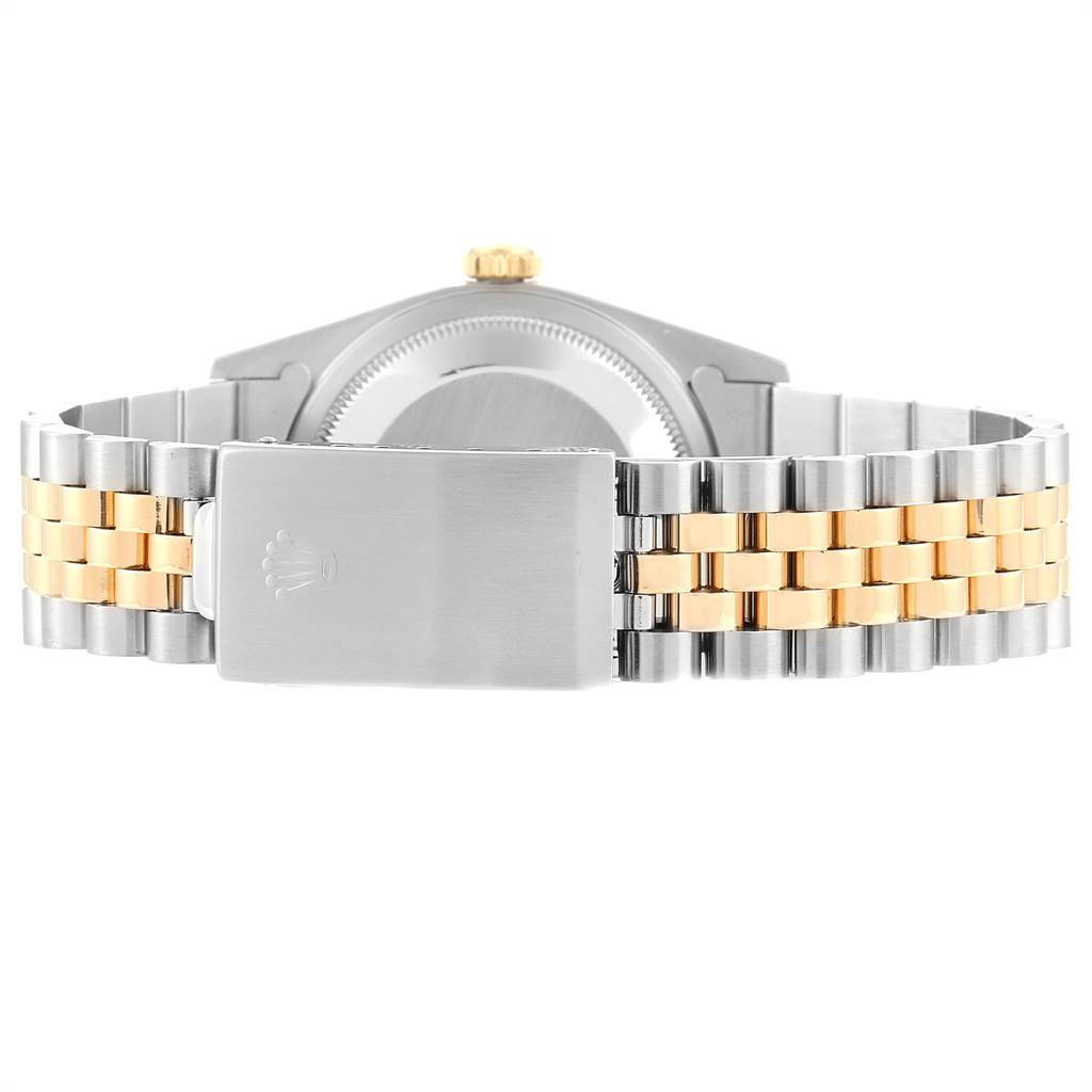 This image shows the back view of a Rolex Datejust 16233 Men's Steel and Gold (two tone) Champagne Dial 16233 Men's Steel and Gold (two tone) Champagne Dial watch, highlighting its two-tone bracelet and clasp.