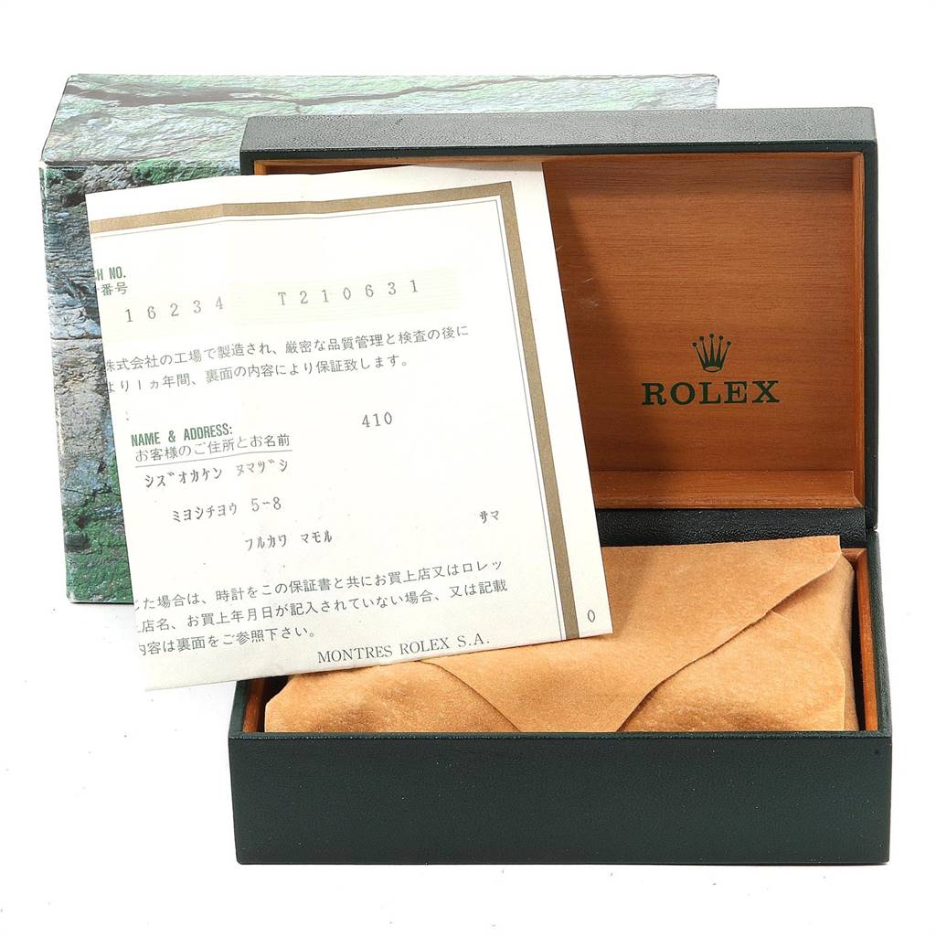 The image shows the Rolex Datejust 16234 Men's Stainless Steel Silver Dial 16234 Men's Stainless Steel Silver Dial watch's open box with a warranty card placed inside.