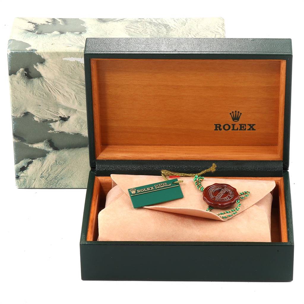 The image shows a Rolex Datejust 16233 Men's Steel and Gold (two tone) Grey Dial 16233 Men's Steel and Gold (two tone) Grey Dial watch box with its accessories, including the tag and seal, but not the watch itself.