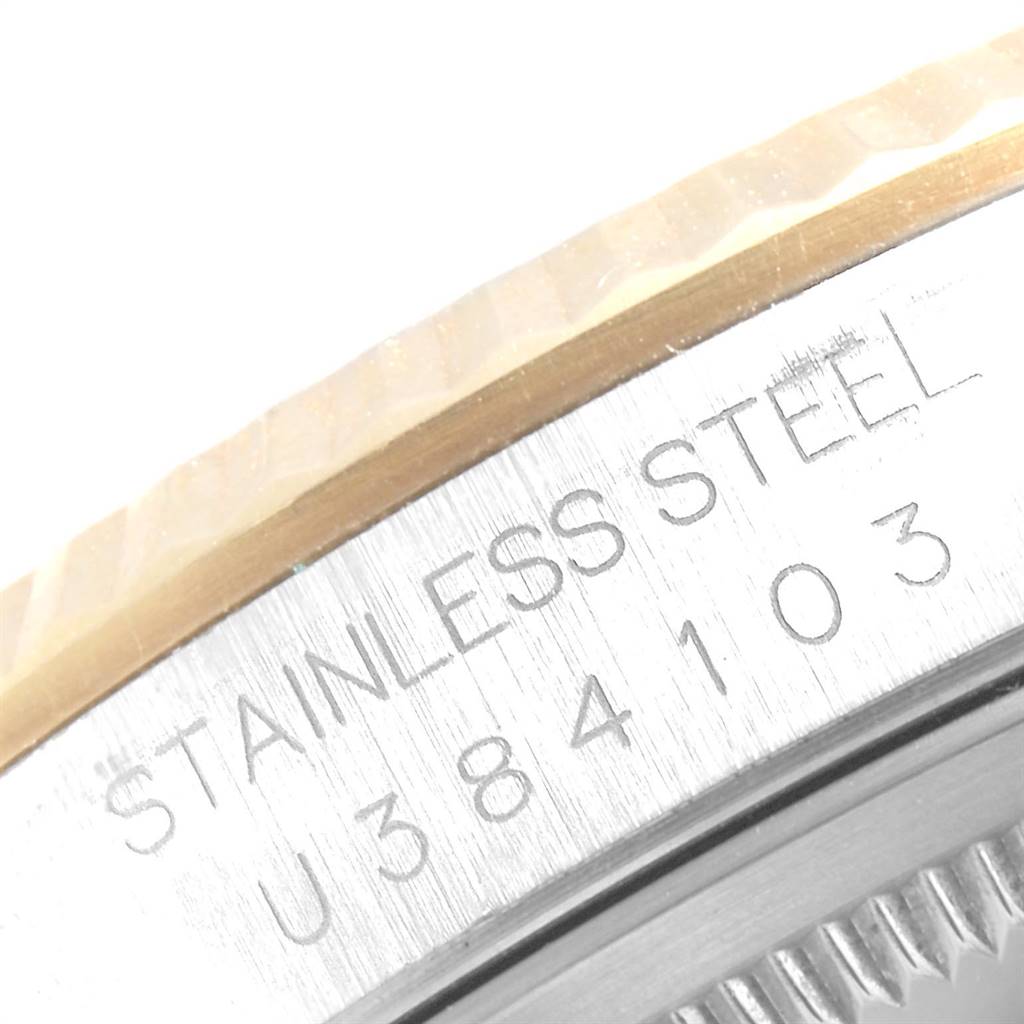 The image shows a close-up of the serial number and material engraving on the case back of a Rolex Datejust 16233 Men's Steel and Gold (two tone) White Dial 16233 Men's Steel and Gold (two tone) White Dial watch.