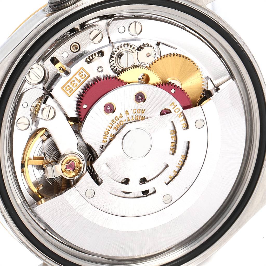 This image shows the internal mechanical movement of a Rolex Datejust 16233 Men's Steel and Gold (two tone) White Dial 16233 Men's Steel and Gold (two tone) White Dial watch from a close-up, rear angle.