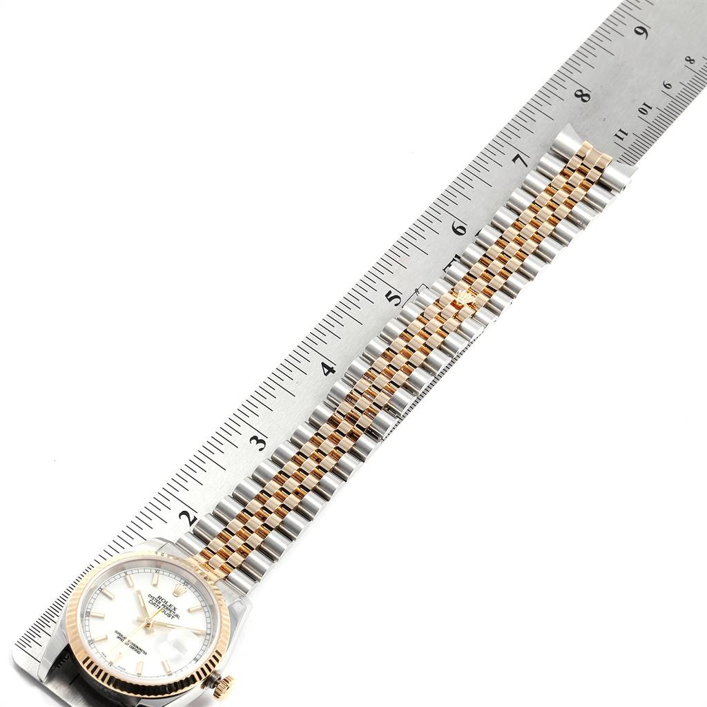 This image shows the Rolex Datejust 116233 Men's Stainless Steel White Dial 116233 Men's Stainless Steel White Dial watch laid flat at an angle, with the bracelet measured by a ruler.