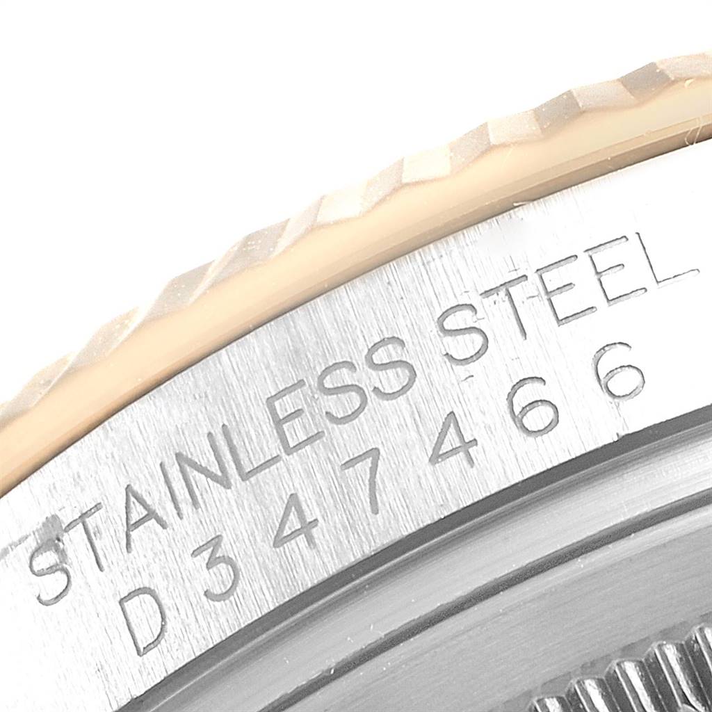 This image shows a close-up of the stainless steel casing and serial number on a Rolex Datejust 116233 Men's Stainless Steel White Dial 116233 Men's Stainless Steel White Dial watch.