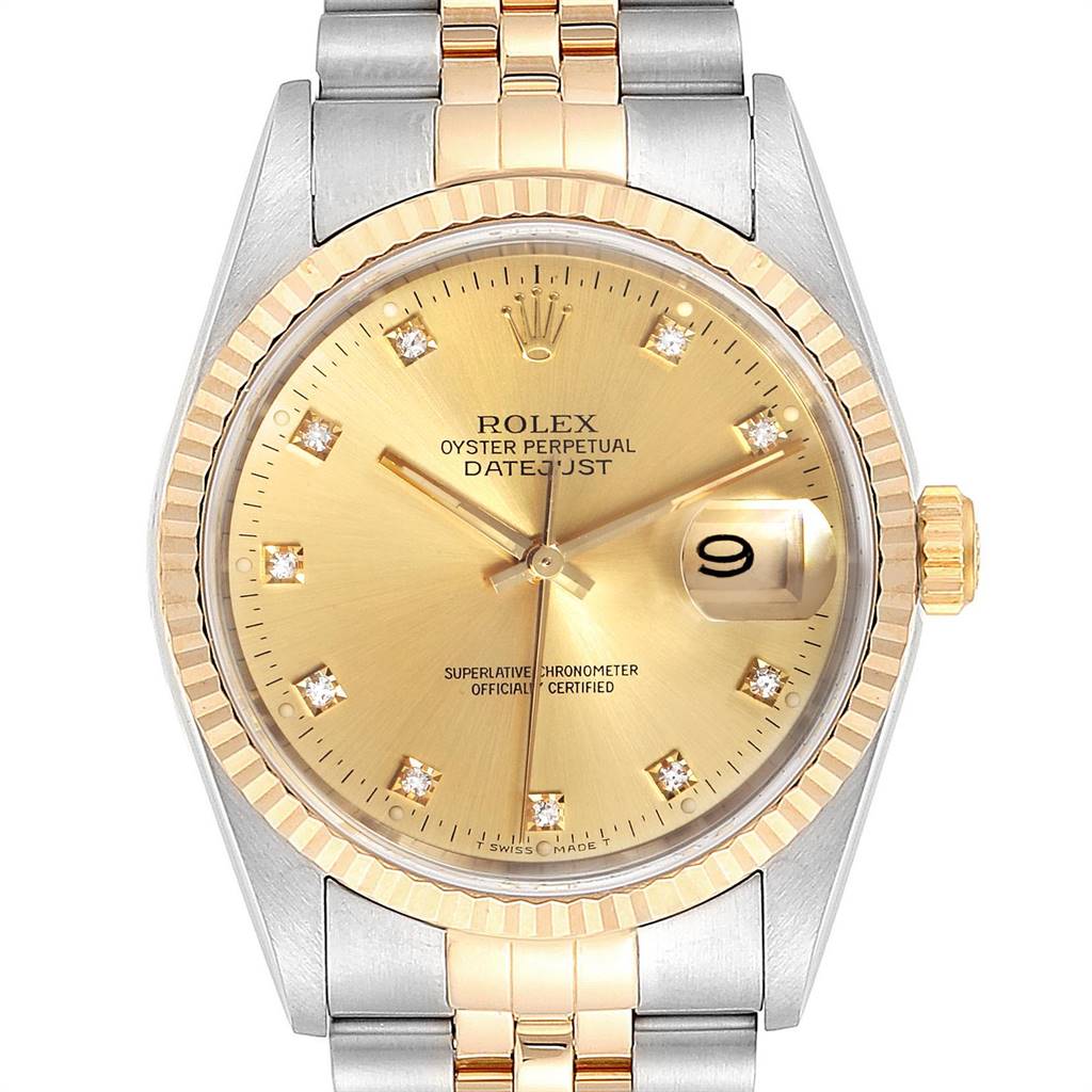 This image shows a frontal view of the Rolex Datejust 16233 Men
s Steel and Gold (two tone) Champagne Dial 16233 Men
s Steel and Gold (two tone) Champagne Dial watch, featuring its gold dial, fluted bezel, and two-tone bracelet.