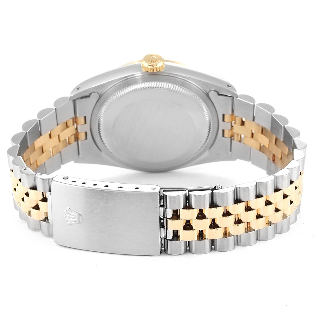 The image shows the backside of a Rolex Datejust 16233 Men
s Steel and Gold (two tone) Champagne Dial 16233 Men
s Steel and Gold (two tone) Champagne Dial watch, highlighting the case back and Jubilee bracelet with clasp.