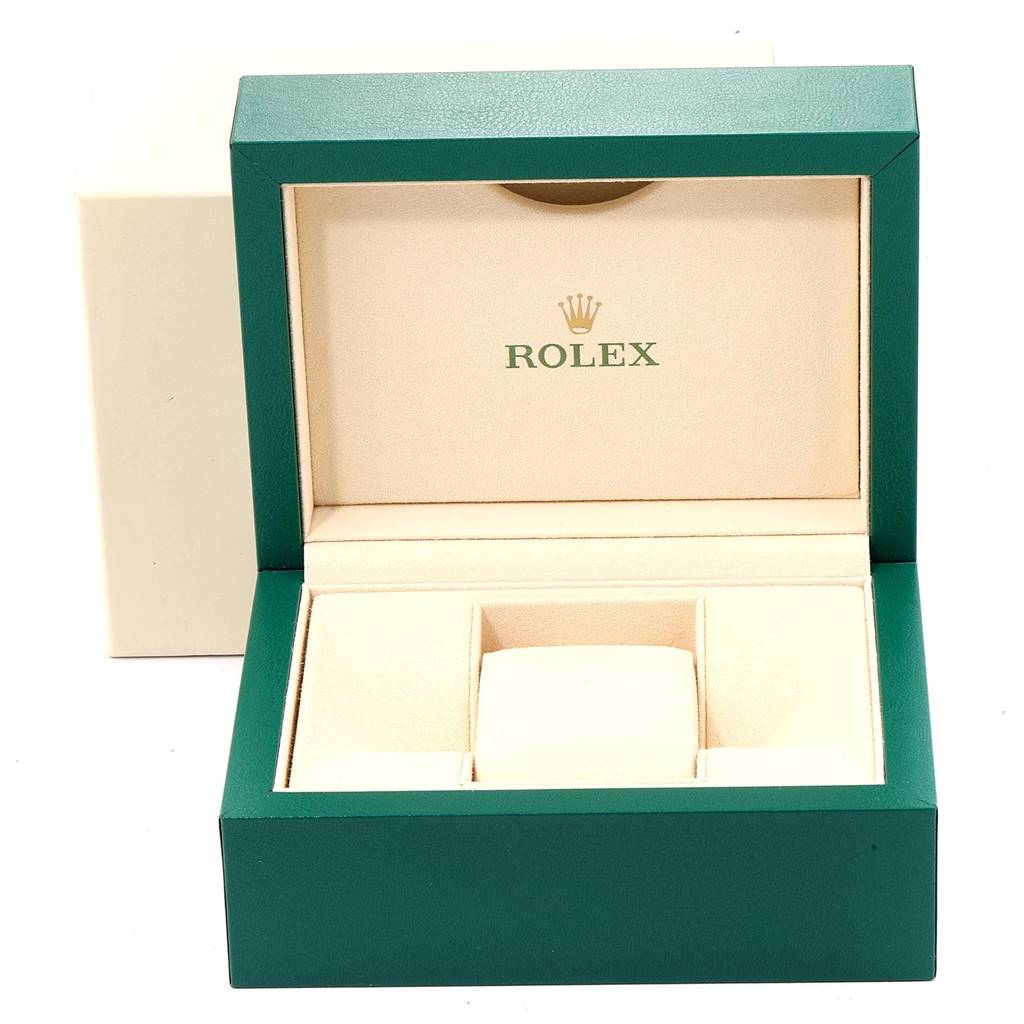 The image shows an open green and beige Rolex watch box for the Datejust model.