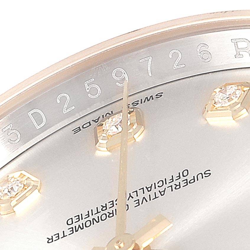 This image shows the upper part of the dial and a segment of the bezel of a Rolex Datejust 116233 Men
s Stainless Steel Silver Dial 116233 Men
s Stainless Steel Silver Dial, including diamond hour markers.